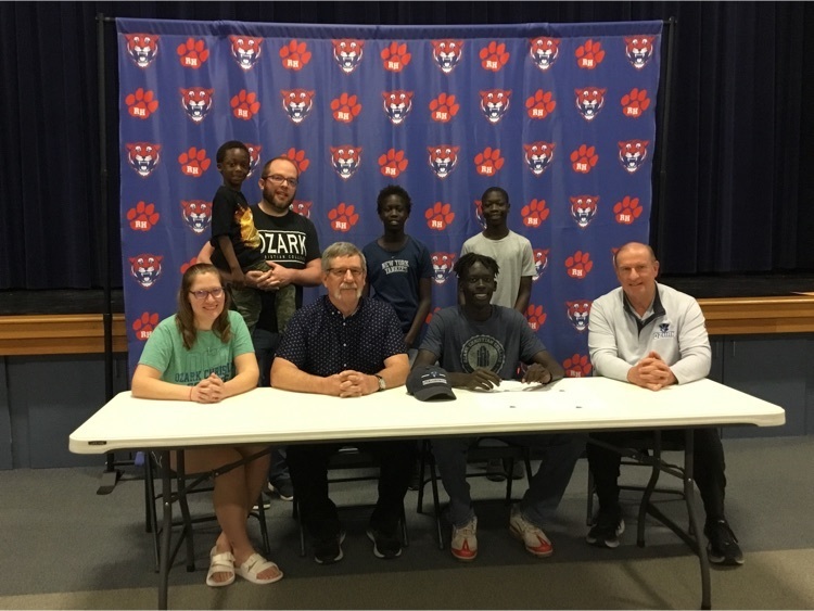 Chol-Case with family, HS coach, and future coach.